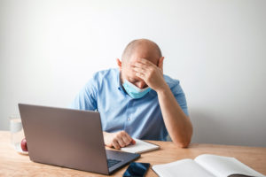 Frustrated worker with laptop