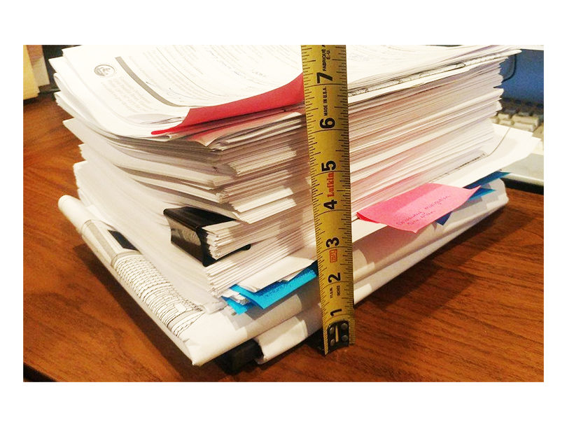 permit reform visual - stack of permits measured with a tape measure