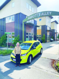 Builder Martha Rose in front of her green, energy-efficient community - Abbotts Alley